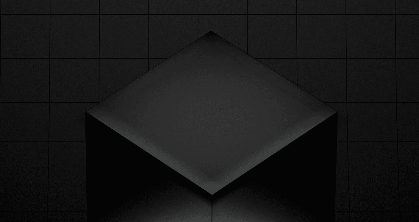 Un cube géométrique noir mat se pose sur un fond carrelé sombre avec un éclairage doux et des ombres subtiles. Cette image abstraite sert de graphique de héros du moteur de jeu Unity 7, représentant des graphismes 3D en temps réel et le développement de jeux.