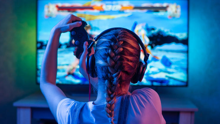 Woman playing a game on console