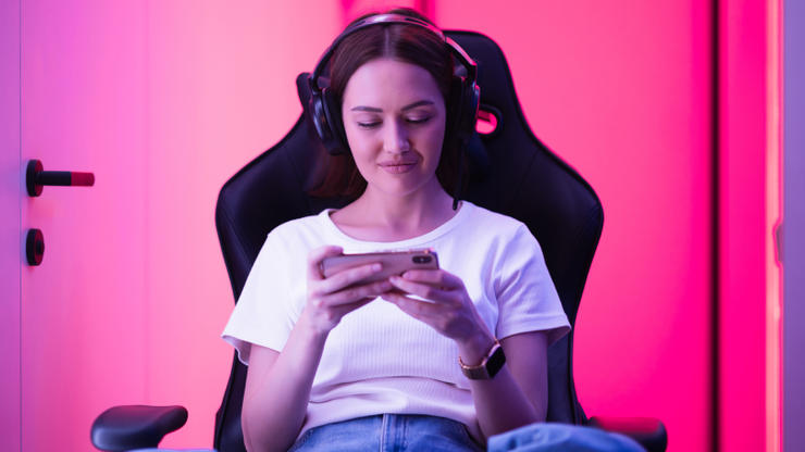 Woman playing a mobile game