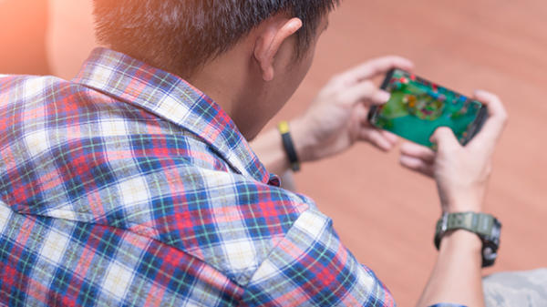 Man playing a mobile game